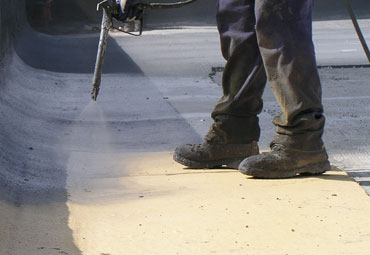 Coating systems over Austin spray foam roof systems